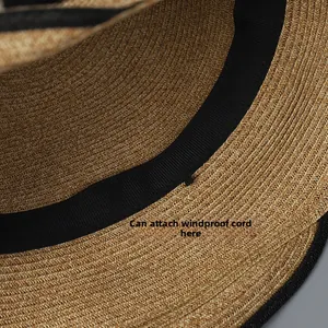 Detail of internal sweatband with a windproof rope attachment point on straw hat