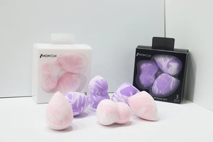 Detailed view of 3-piece marble makeup sponge set with teardrop and slanted cut shapes