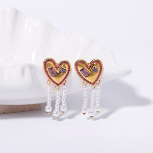 Golden heart earrings with pink and purple rhinestones and elegant pearl tassels