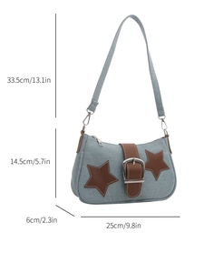 Detailed size specifications of a blue denim shoulder bag with brown leather stars