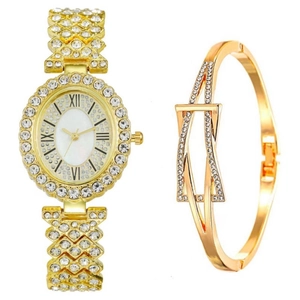 Detail of luxury gold oval quartz watch with crystal inlay and matching metal bracelet