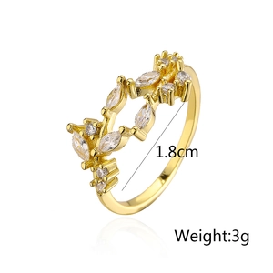 Detail showing 1.8cm diameter and 3g weight of leaf-shaped gold plated ring with zircons