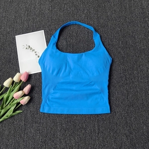 Detail of bright blue seamless yoga top featuring a halter neck and ribbed texture