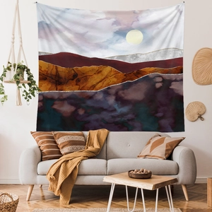 Detail of abstract landscape tapestry showing mountains, moon and soft polyester fabric