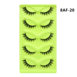 Macro detail of 5 pairs of cat-eye false eyelashes with natural density on green tray