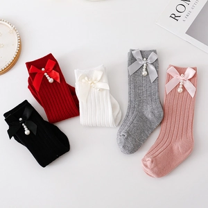 Spanish style knit ribbed baby socks with satin bows and pearl charms in five colors