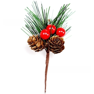 Close-up of artificial red berries and pine cones with green needles for Xmas decor