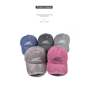 Close-up of five distressed cotton baseball caps featuring elaborate vintage embroidery