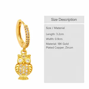 Detailed view of owl-shaped gold earrings with white zircons and dimensions of 3.2cm