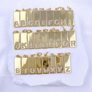 Detailed set of 26 rectangular gold pendants with sparkling cubic zirconia inlaid letters
