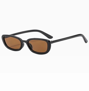 Close-up of retro black oval sunglasses with brown lenses and sleek glossy frames