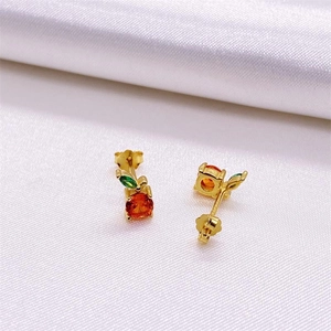 S925 sterling silver red grapefruit stud earrings with orange and green gems on white silk
