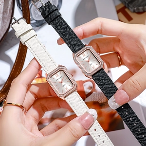 Detail view of octagon rose gold watches with crystal bezels and leather straps
