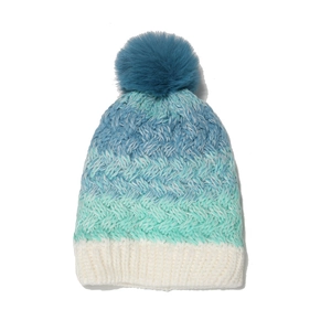 Thick gradient knitted beanie with colorful stripes and a dark teal faux fur pom pom