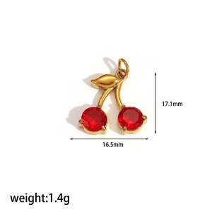 Macro shot of 17.1mm red cherry charm with gold leaf and sizing details