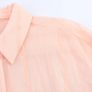 Detail shot of the vertical striped texture on the collar of this pink women shirt