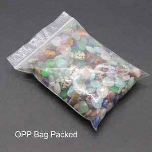 Mixed natural crystal heart pendants and faceted stones in various colorful gemstones