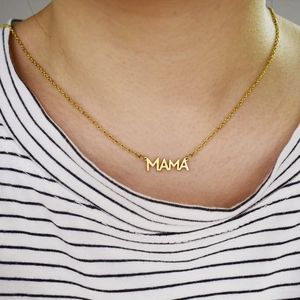 Elegant gold-tone Mama necklace in stainless steel shown on a female model neck