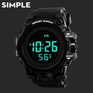 Detail of digital sport watch with green luminous backlight and large black dial
