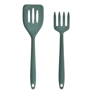 Close-up of a dark green silicone slotted turner and pasta fork kitchen utensil set