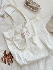 White canvas tote bag with pink bow embroidery and large capacity for daily commuting