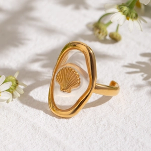 18k gold plated stainless steel open ring featuring a shell motif in an oval frame