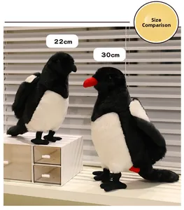 Size comparison showing 22cm and 30cm lifelike black and white magpie plush birds