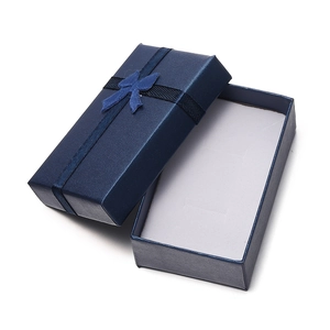 Navy blue rectangular jewelry gift box with textured surface and ribbon bow detail