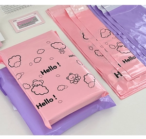 Close-up of pink and purple cartoon bear waterproof plastic mailing bags for packaging