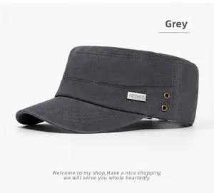 Detail of grey cotton cadet cap featuring side metal vent holes and a metallic logo tag