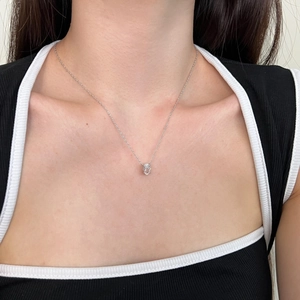 Close-up of S925 sterling silver perfume bottle pendant necklace on female model neck