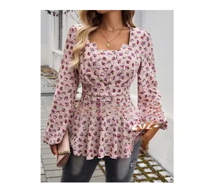 Detail of floral puff sleeve top showing square neck design and pleated waist for slim fit