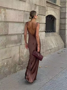 Detail of silk-satin maxi dress with backless design and thin straps in dark brown