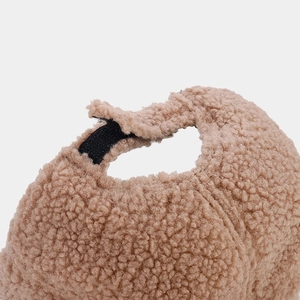 Close-up of adjustable velcro strap on thick solid color fleece baseball cap detail