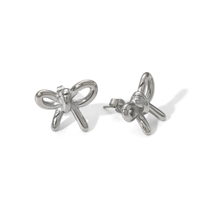 Macro shot of silver bow knot stud earrings in polished stainless steel finish