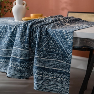 Blue geometric triangle pattern cotton linen tablecloth on a cozy dining table setup
