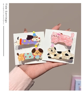 Detailed close-up of colorful cartoon puppy and cat acetate hair clips for girls