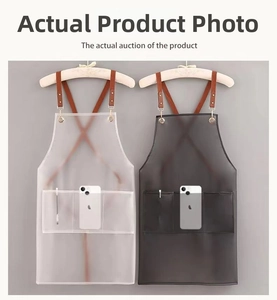 Detail of waterproof TPU aprons with cross-back leather straps and functional pockets