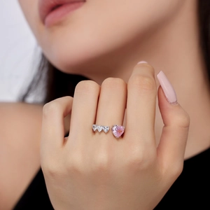 Detail of S925 silver snake ring featuring sparkling pink and clear heart shaped zircons