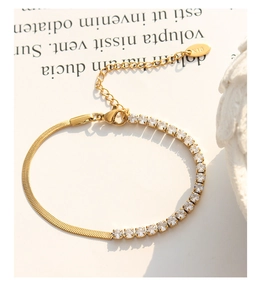 Close-up of gold plated necklace showing flat snake chain and zircon tennis style detail