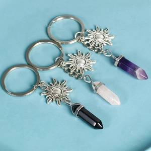 Three sun charms with amethyst rose quartz and obsidian crystal hexagon pendants