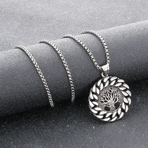 Silver vintage Viking Tree of Life pendant in stainless steel on textured display