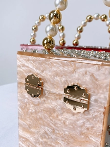 Chic acrylic evening box bag with marble texture and gold metal hinges detail