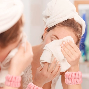 Soft pink coral fleece wristbands for face washing, preventing water from dripping down arms