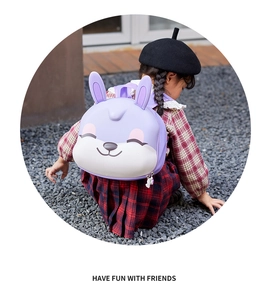Detail of a purple EVA rabbit-shaped children's backpack shown in an outdoor setting