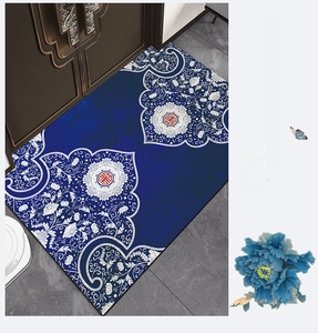 Detailed top view of New Chinese style door mat with blue floral and red pattern