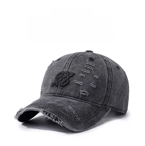 Close-up of distressed charcoal grey baseball cap showing embroidery and ripped details