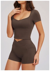 Detail of square neck yoga crop top with high waist pocket shorts in chocolate brown