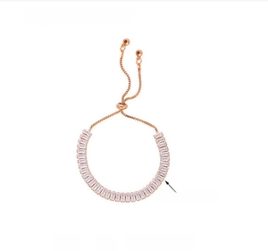 Detailed macro shot of rose gold slider bracelet with rectangle cubic zirconia stones