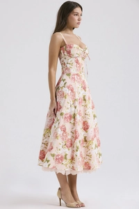 Detail view of the pink floral sundress featuring a waist-cinching design and pleated chest